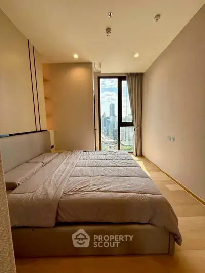 Luxurious bedroom with stunning city view and modern decor