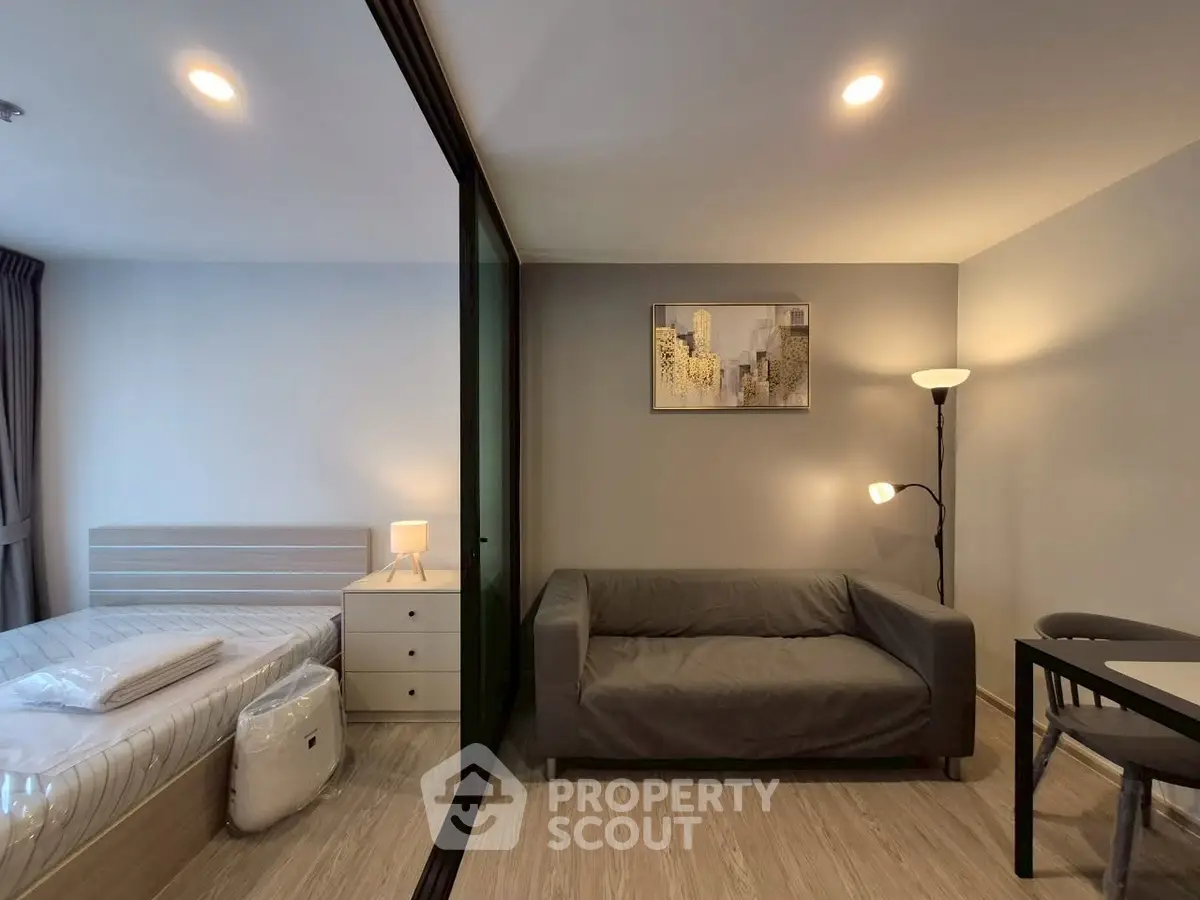 Modern studio apartment with cozy living area and stylish decor