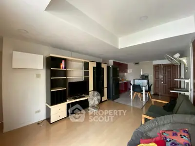 Spacious living room with modern furniture and open kitchen layout