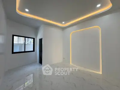 Modern minimalist room with elegant lighting and marble flooring