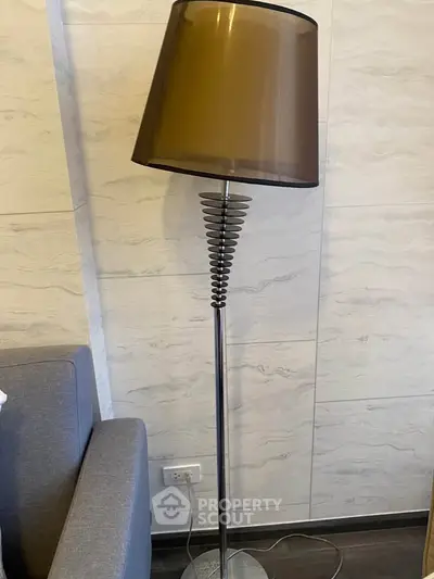 Modern floor lamp with sleek design in stylish living room corner
