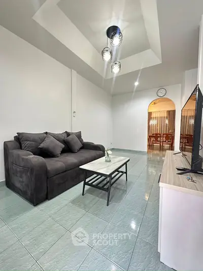 Modern living room with stylish lighting and cozy seating area