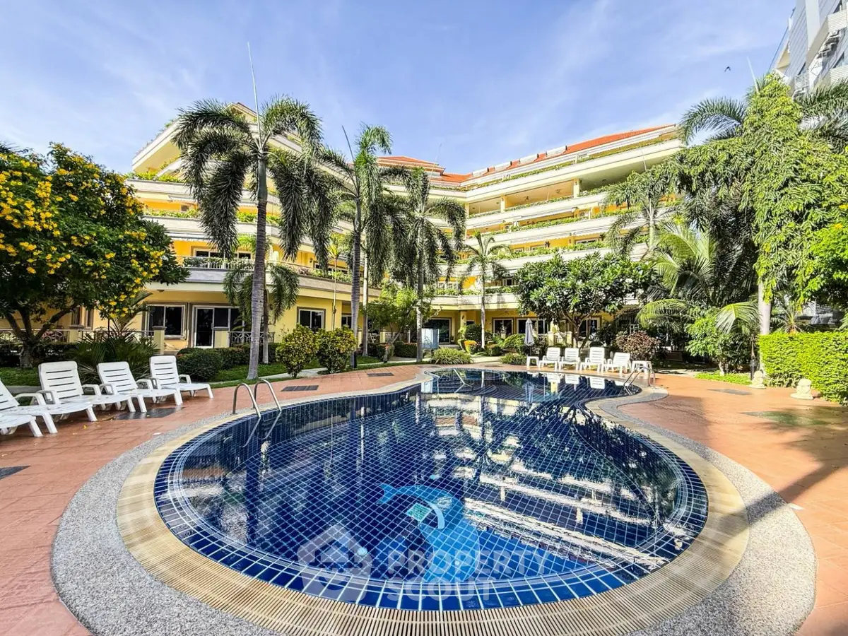 Luxurious apartment complex with stunning pool and lush gardens