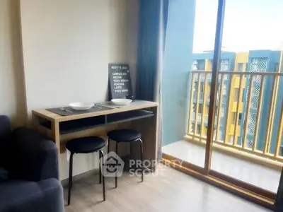 Modern apartment with cozy dining area and balcony view