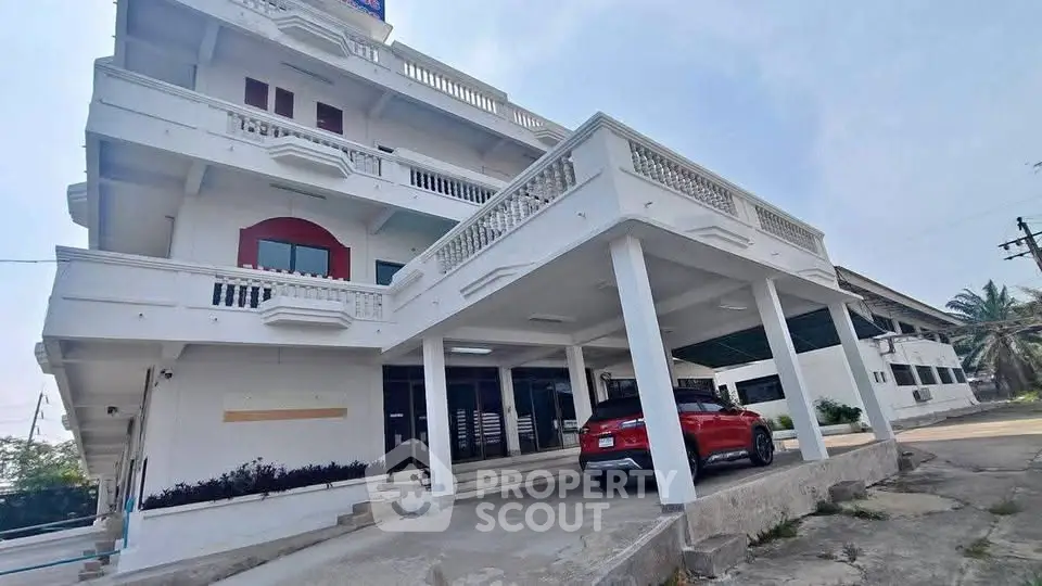 Spacious multi-story building with ample parking and modern design.
