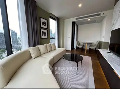 Luxurious modern living room with city view, elegant furniture, and stylish decor in high-rise apartment.