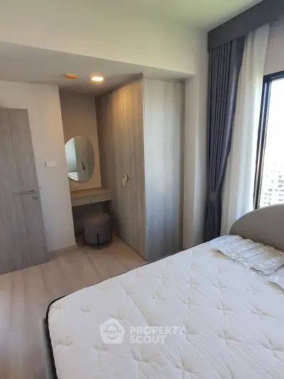 Modern bedroom with stylish wardrobe and natural light