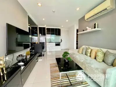 Modern living room with sleek design and air conditioning, featuring stylish decor and glossy flooring.