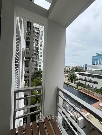 Modern apartment balcony with city view and sleek railing design