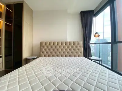 Luxurious bedroom with city view and elegant furnishings