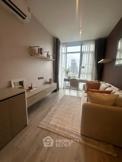 Modern living room with city view, stylish decor, and natural light