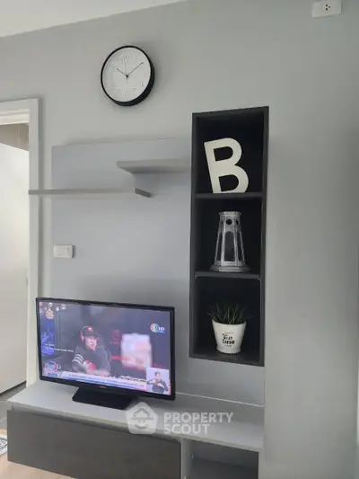 Modern living room with sleek TV unit and stylish decor