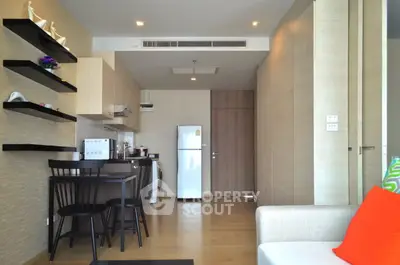Modern open-layout kitchen with dining area and stylish decor