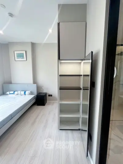 Modern bedroom with sleek storage and minimalist design