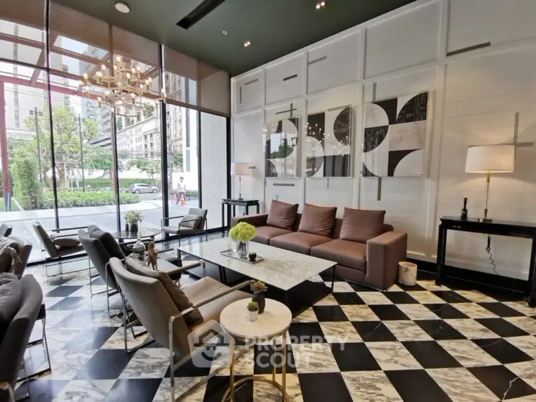 Luxurious modern living room with stylish decor and large windows offering a stunning view.