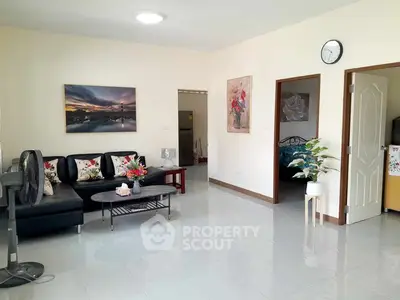 Spacious living room with modern decor and natural light