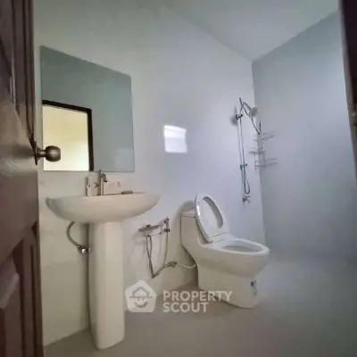 Modern bathroom with sleek fixtures and minimalist design.