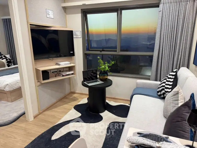 Modern living room with stunning sunset view, stylish decor, and cozy seating area.