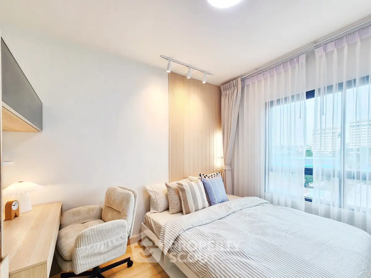 Bright and cozy bedroom with modern decor and large window view