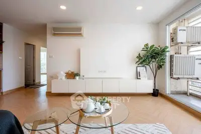 Modern living room with minimalist decor and large window view