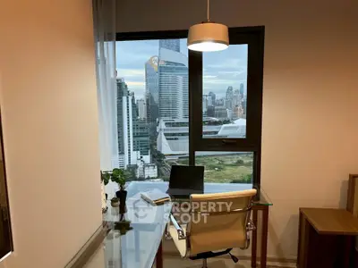 Modern home office with stunning city view, featuring sleek glass desk and stylish chair.