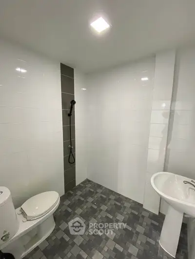 Modern bathroom with sleek tiles and minimalist fixtures