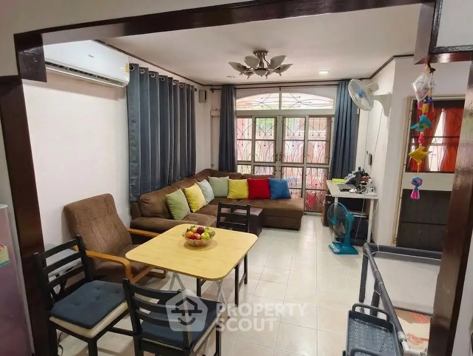 Cozy living room with modern furniture and natural light, perfect for relaxation and entertaining.