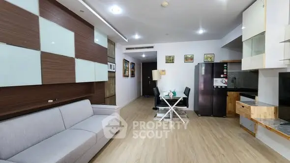 Modern open-plan living room with sleek kitchen and dining area