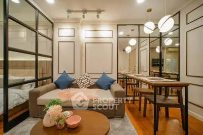 Chic modern living room with stylish decor and dining area, perfect for urban living.