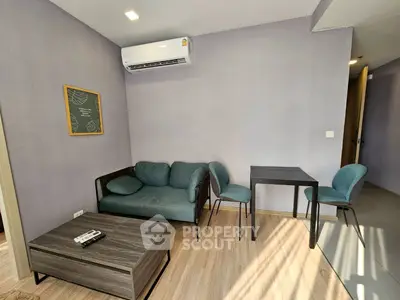 Modern living room with stylish furniture and air conditioning