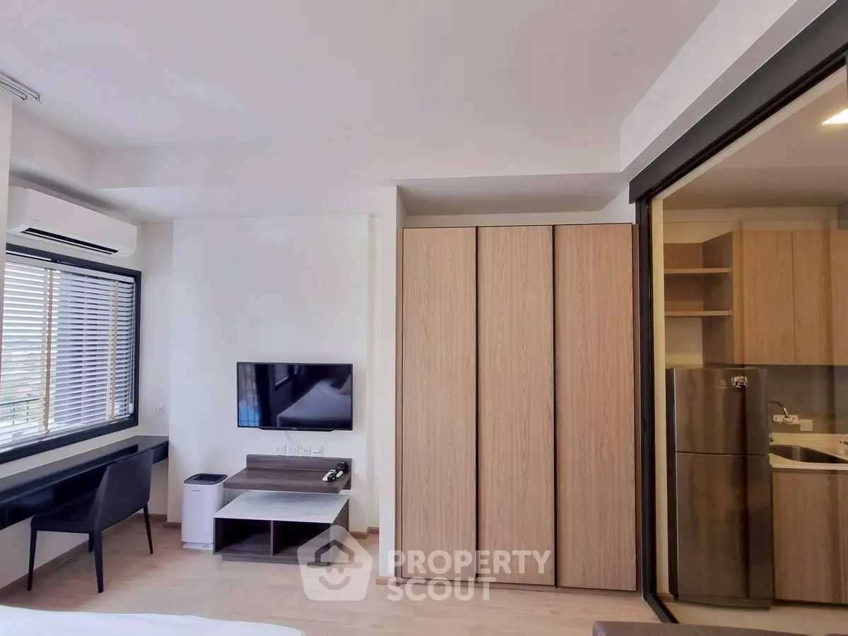 Modern studio apartment with sleek design and ample natural light