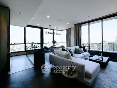 Luxurious modern living room with panoramic city views and elegant furnishings.
