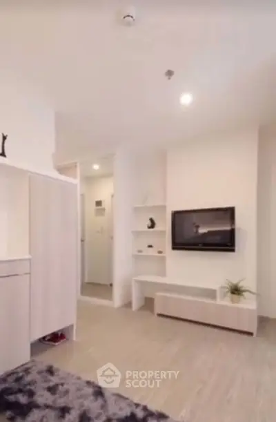 Modern living room with sleek TV setup and minimalist decor