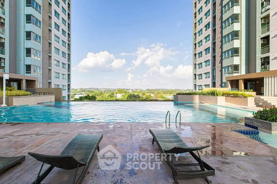 Luxurious apartment complex with stunning pool and scenic views, perfect for relaxation and leisure.