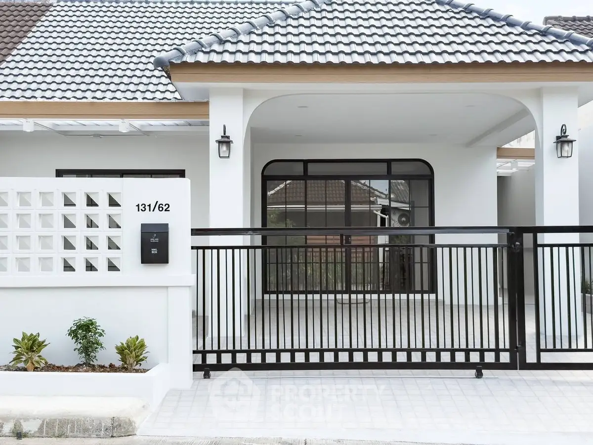 Modern single-story house with stylish gate and tiled roof