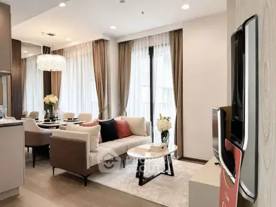 Luxurious modern living room with elegant decor and large windows for natural light.