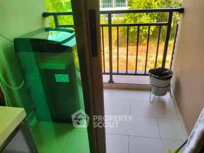 Charming balcony with washing machine and scenic view, perfect for urban living convenience.