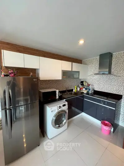 Modern kitchen with sleek appliances and stylish cabinetry