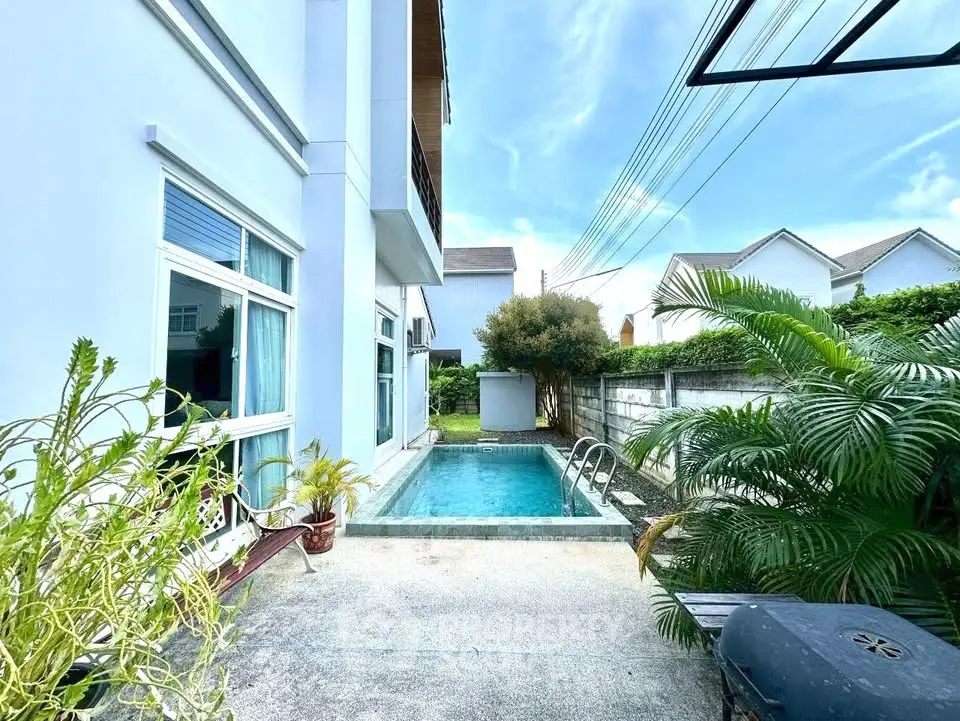 Charming residential property with private pool and lush greenery, perfect for relaxation and outdoor enjoyment.