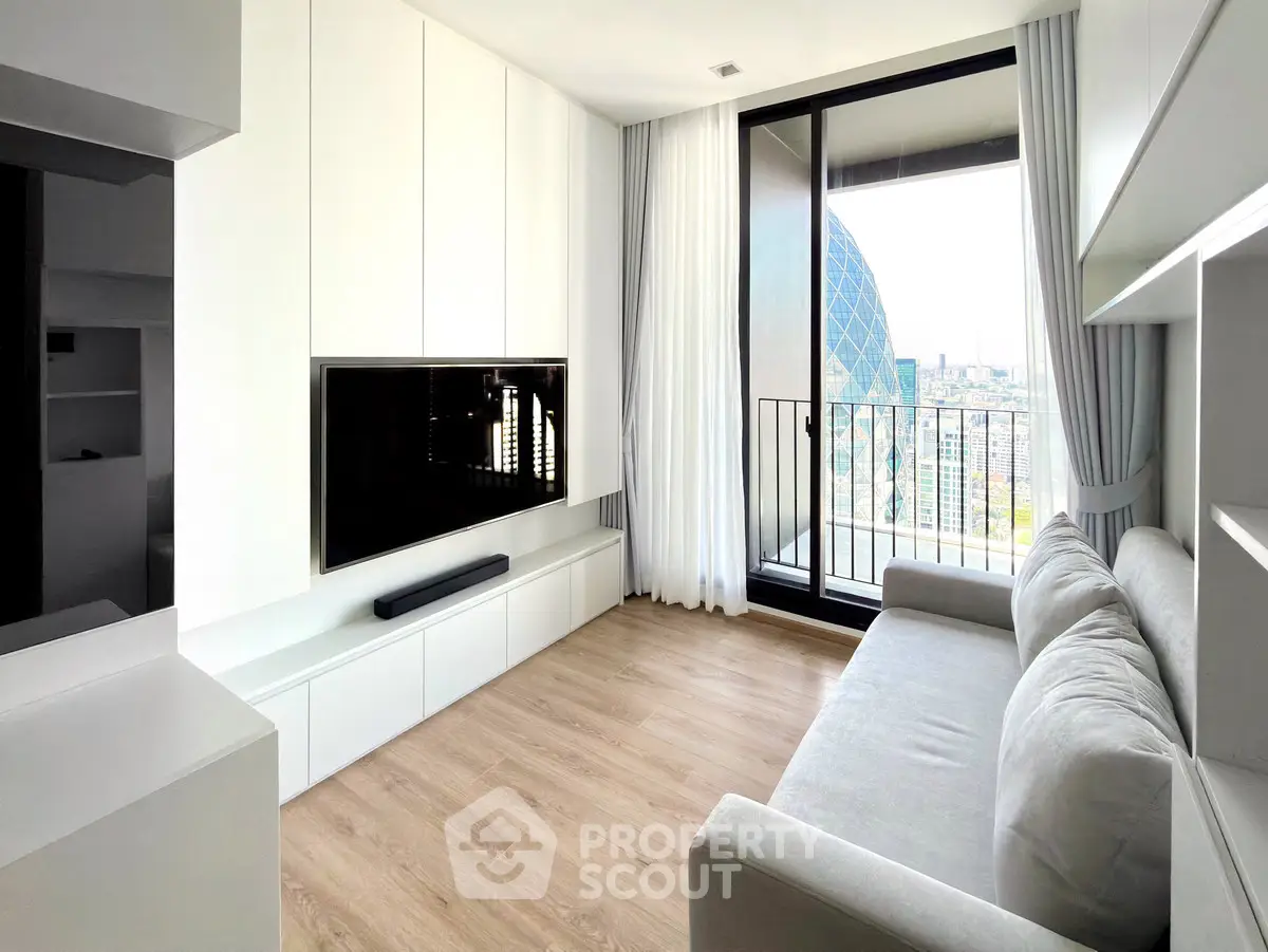 Modern living room with sleek design and city view balcony.