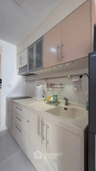 Modern kitchen with sleek cabinetry and integrated appliances