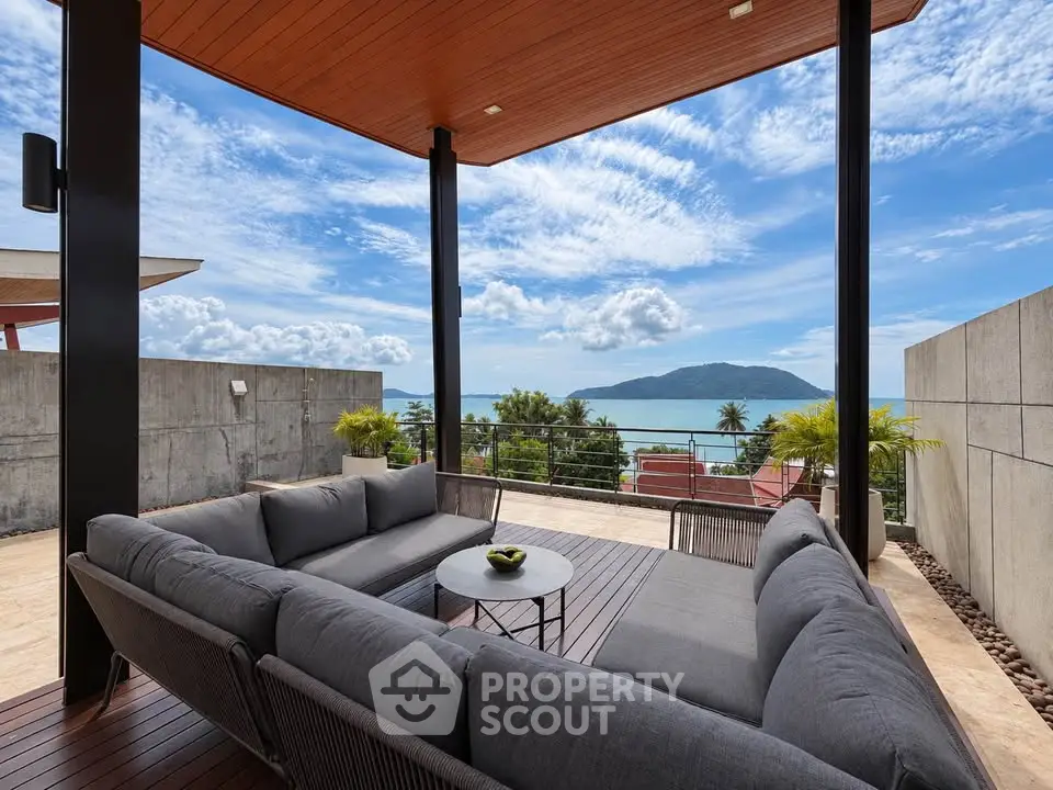Stunning rooftop terrace with ocean view and modern outdoor seating.