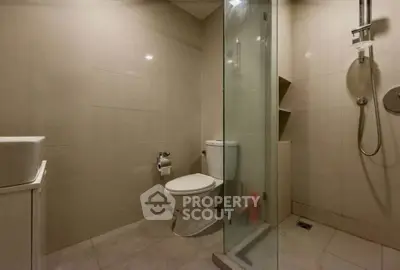 Modern bathroom with glass shower and sleek fixtures