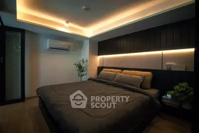 Luxurious modern bedroom with ambient lighting and stylish decor