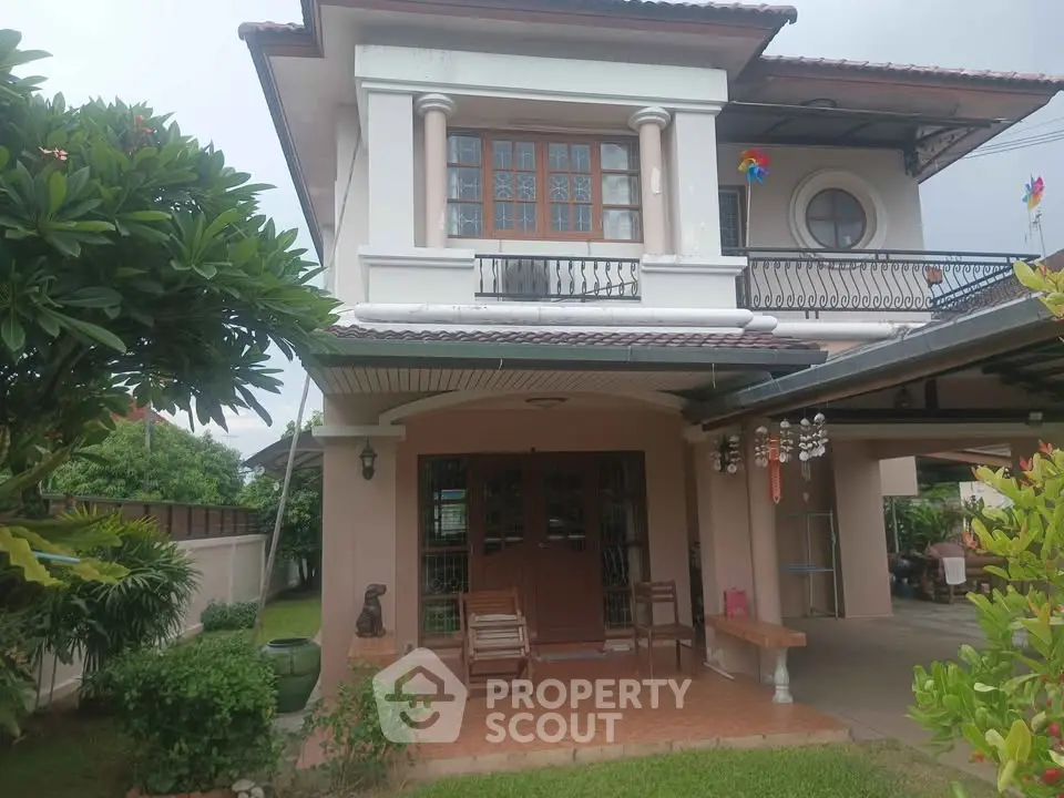 Charming two-story house with lush garden and spacious patio in serene neighborhood.