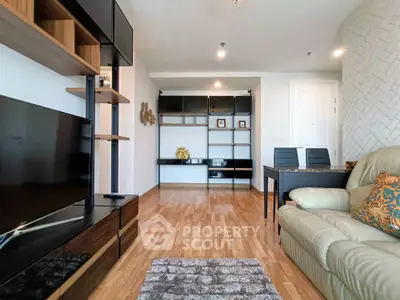 Modern living room with stylish furniture and wooden flooring in a contemporary apartment.