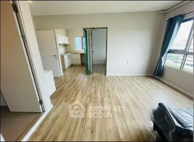Spacious apartment with open layout and large windows offering city views