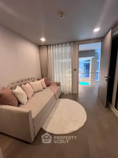 Cozy living room with modern decor and pool view