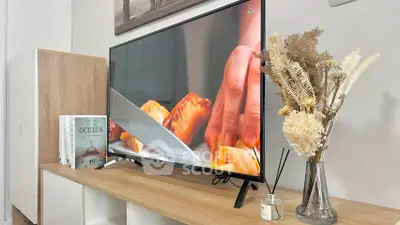 Modern living room with stylish TV setup and elegant decor