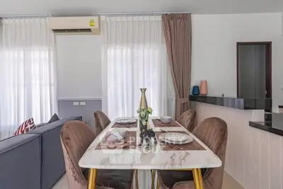 Stylish dining area with elegant decor and modern furniture in a cozy living space.